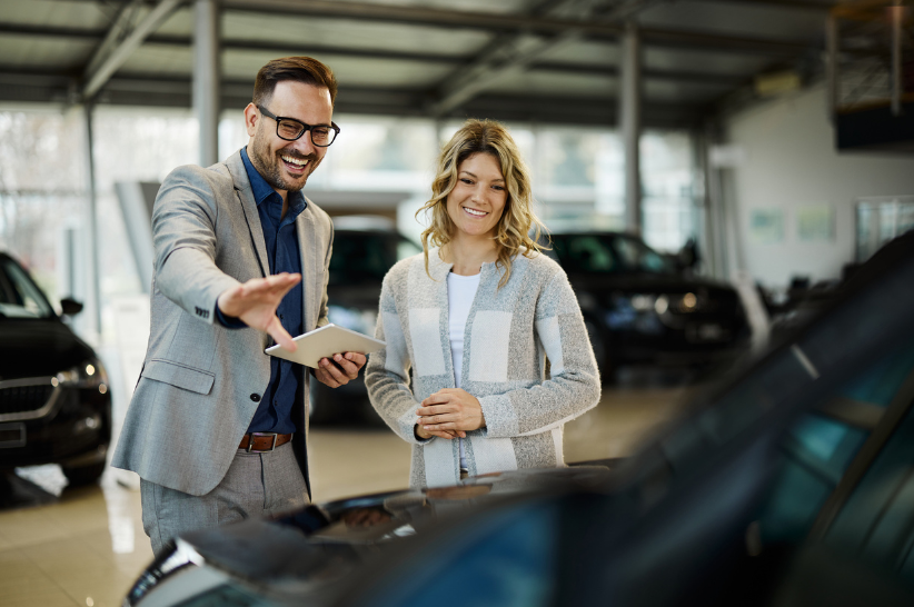 Car dealer with customers