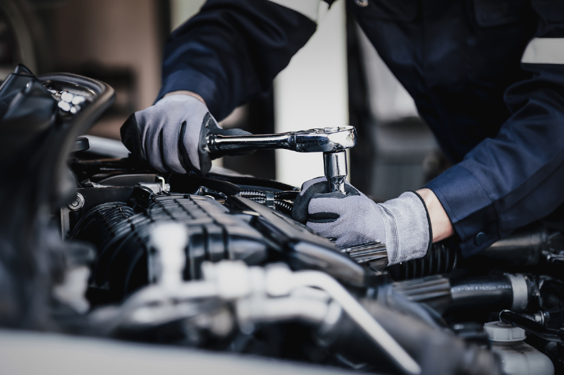 inspector working on car